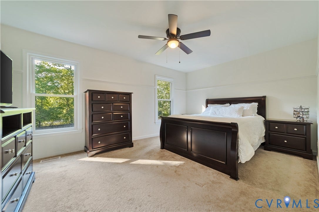 11060 Forest Trace Way, Forest Trace, Glen Allen, VA 23059 Bright room with light-toned carpeting, white walls, and a ceiling fan with integrated lighting