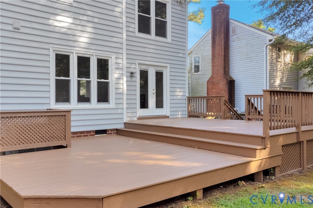 11060 Forest Trace Way, Forest Trace, Glen Allen, VA 23059 Expansive multi-level wood-finish deck with integrated steps, lattice detailing, and dual French doors