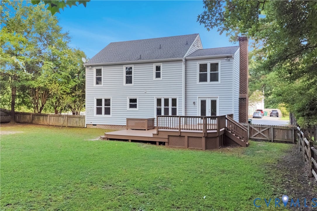 11060 Forest Trace Way, Forest Trace, Glen Allen, VA 23059 Expansive grass lawn with a multi-level wood deck, light blue siding, and a brick chimney