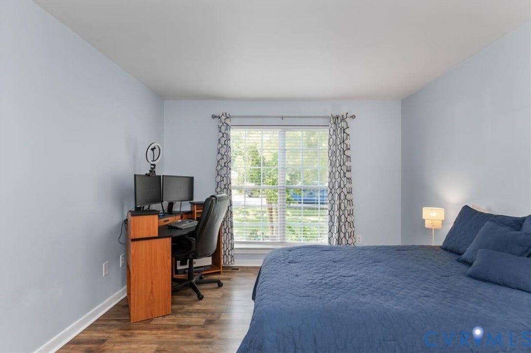 1st Floor Primary Ensuite with attached bath and walk in closet behind the barn door.