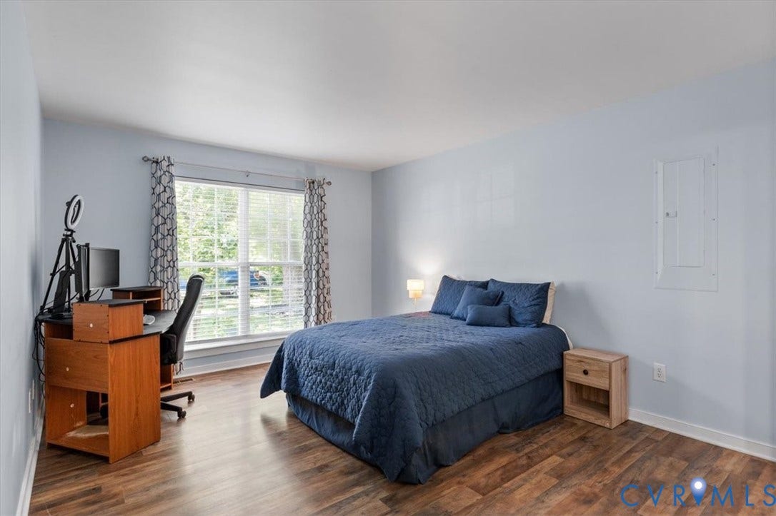 1st Floor Primary Ensuite with attached bath and walk in closet behind the barn door.