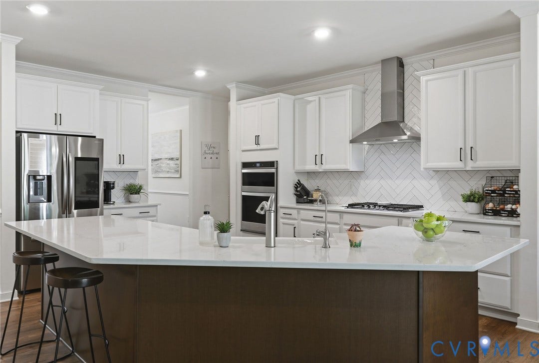 quartz countertops, stainless appliances, gas cooktop