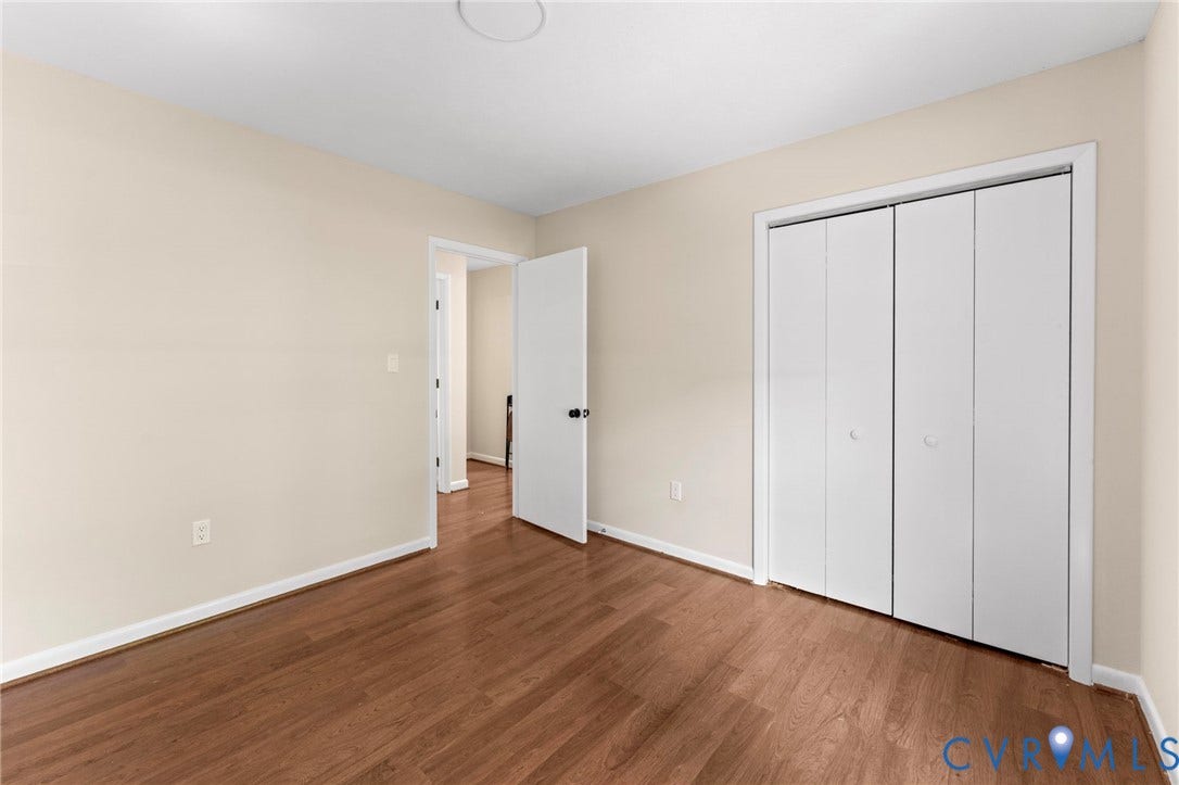 3020 Sand Hills Drive, Chester, VA 23831 Room featuring wood-finish flooring, light-toned walls, and white trim