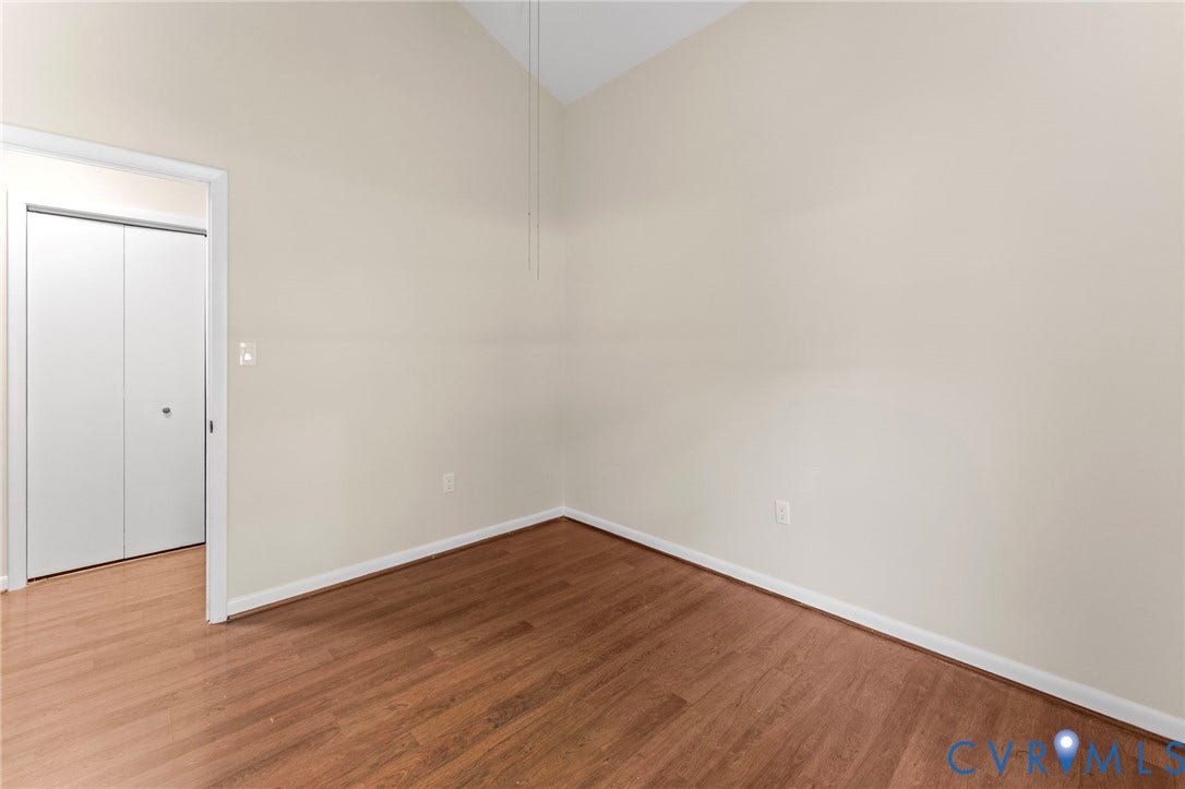 3020 Sand Hills Drive, Chester, VA 23831 Room featuring wood-finish flooring, light neutral wall paint, and white baseboards