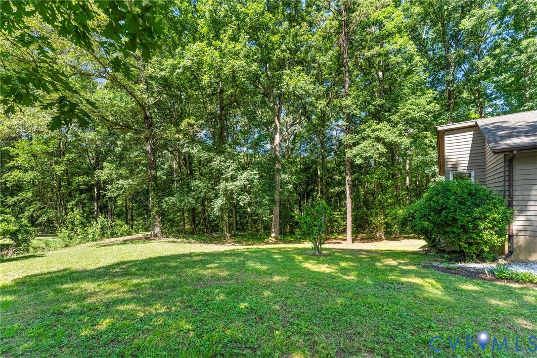 3020 Sand Hills Drive, Chester, VA 23831 Expansive green lawn surrounded by mature trees