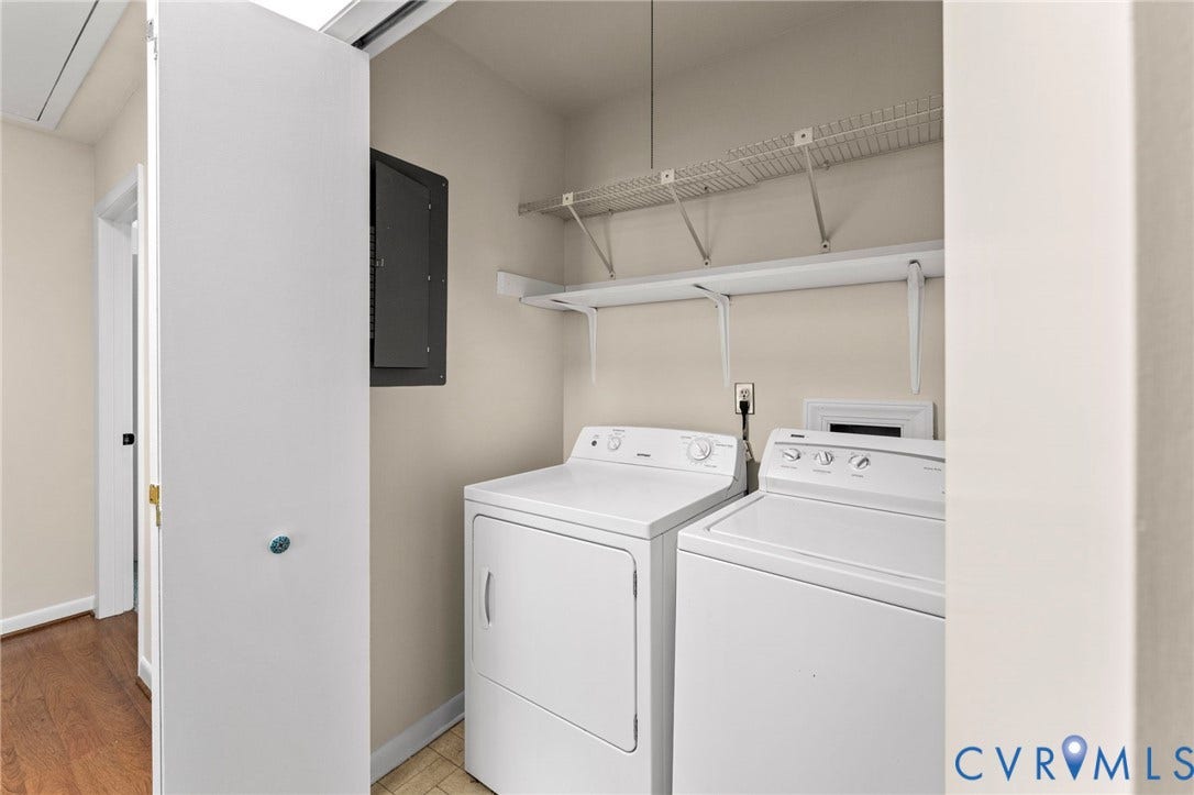 3020 Sand Hills Drive, Chester, VA 23831 Dedicated laundry closet featuring a white washing machine and dryer, overhead wire shelving, and light neutral wall paint