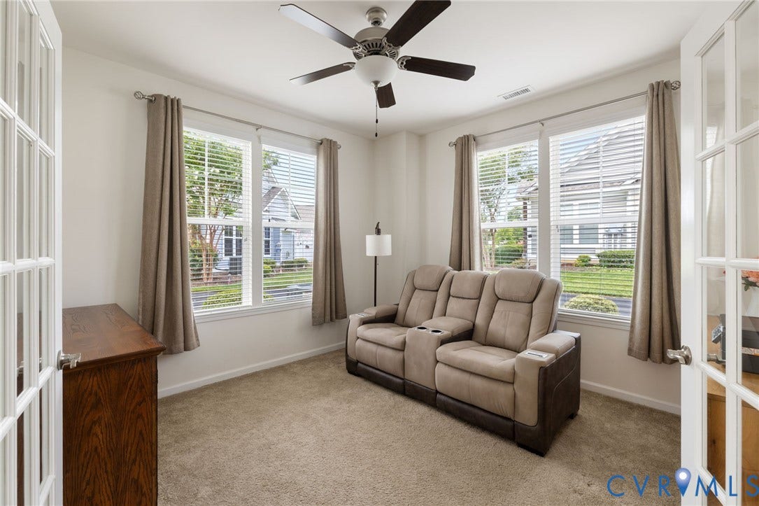 12128 Magnolia Bluff Court, Villas At Magnolia Lakes, Chester, VA 23831 Room featuring French doors, a ceiling fan with light, and two large windows with blinds and drapes