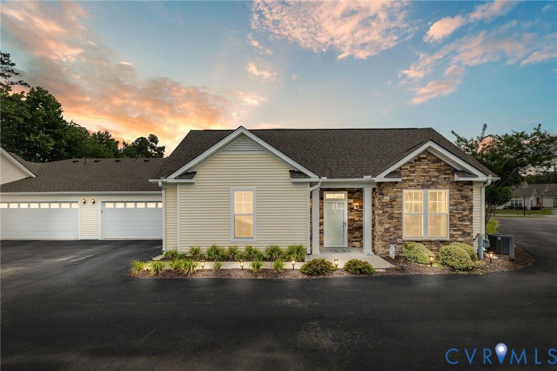 12128 Magnolia Bluff Court, Villas At Magnolia Lakes, Chester, VA 23831 Exterior featuring light-colored siding, natural stone veneer, a covered entryway, and an asphalt driveway