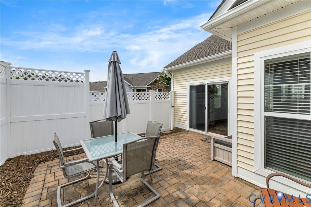 12128 Magnolia Bluff Court, Villas At Magnolia Lakes, Chester, VA 23831 Brick paver patio with white privacy fencing