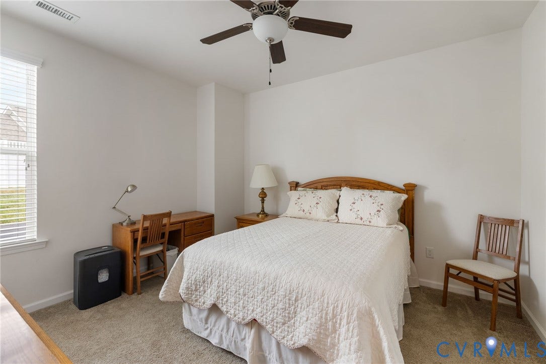 12128 Magnolia Bluff Court, Villas At Magnolia Lakes, Chester, VA 23831 Carpeted room featuring a ceiling fan with integrated lighting, a window with blinds, and white walls