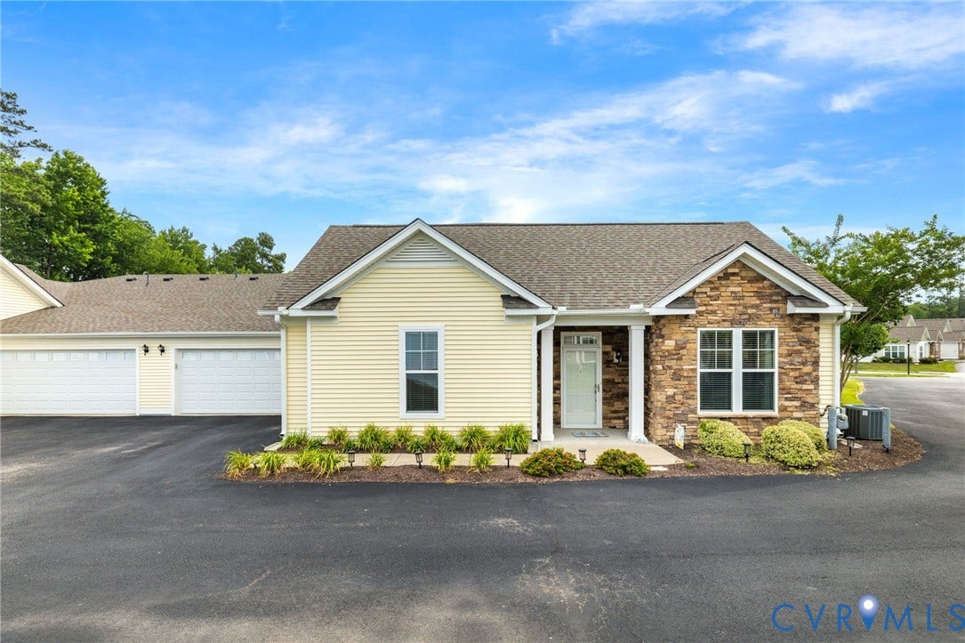 12128 Magnolia Bluff Court, Villas At Magnolia Lakes, Chester, VA 23831 Exterior featuring light yellow siding and stone veneer accents