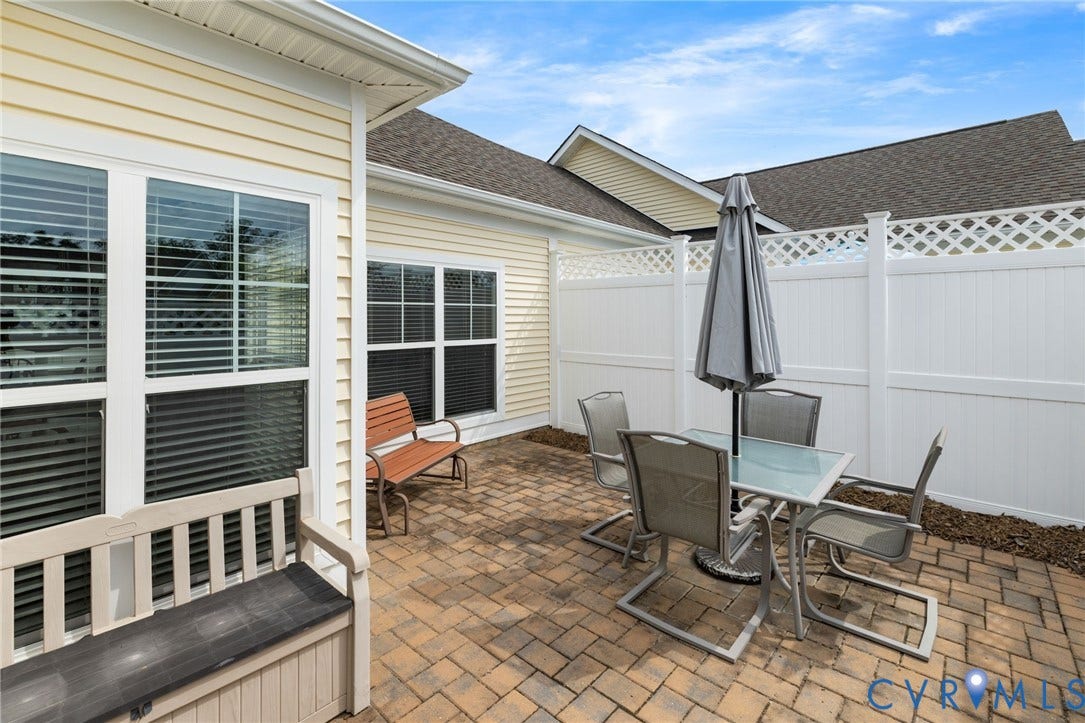 12128 Magnolia Bluff Court, Villas At Magnolia Lakes, Chester, VA 23831 Outdoor paver patio featuring a full privacy fence with lattice top