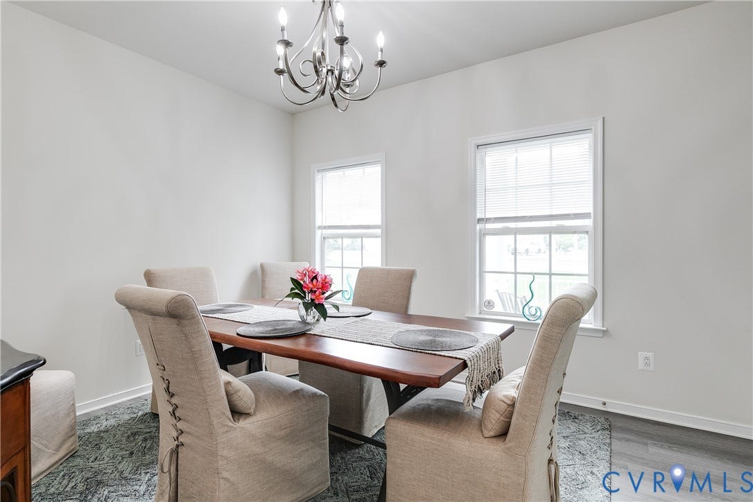 2244 Thomas Kenney Drive, Henrico, VA 23060 Formal Dining Room Featuring New LVP Flooring and Chandelier.