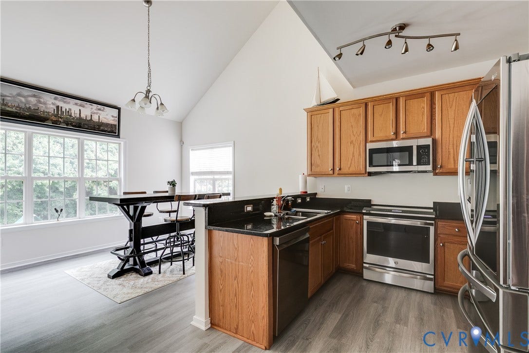2244 Thomas Kenney Drive, Henrico, VA 23060 Kitchen Featuring New LVP Flooring, Stainless Steel Appliances, and Granite Countertops.