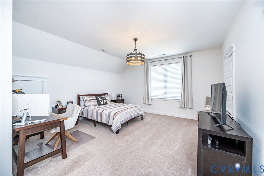 2112 Avada Drive, Newmarket Estates, Midlothian, VA 23112 Primary Br 2 on 2nd Floor with Carpet and ceiling chandelier