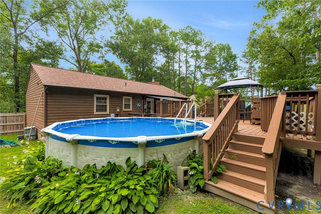 11330 Great Branch Drive, Chester, VA 23831 Expansive multi-level wood deck with integrated above-ground pool