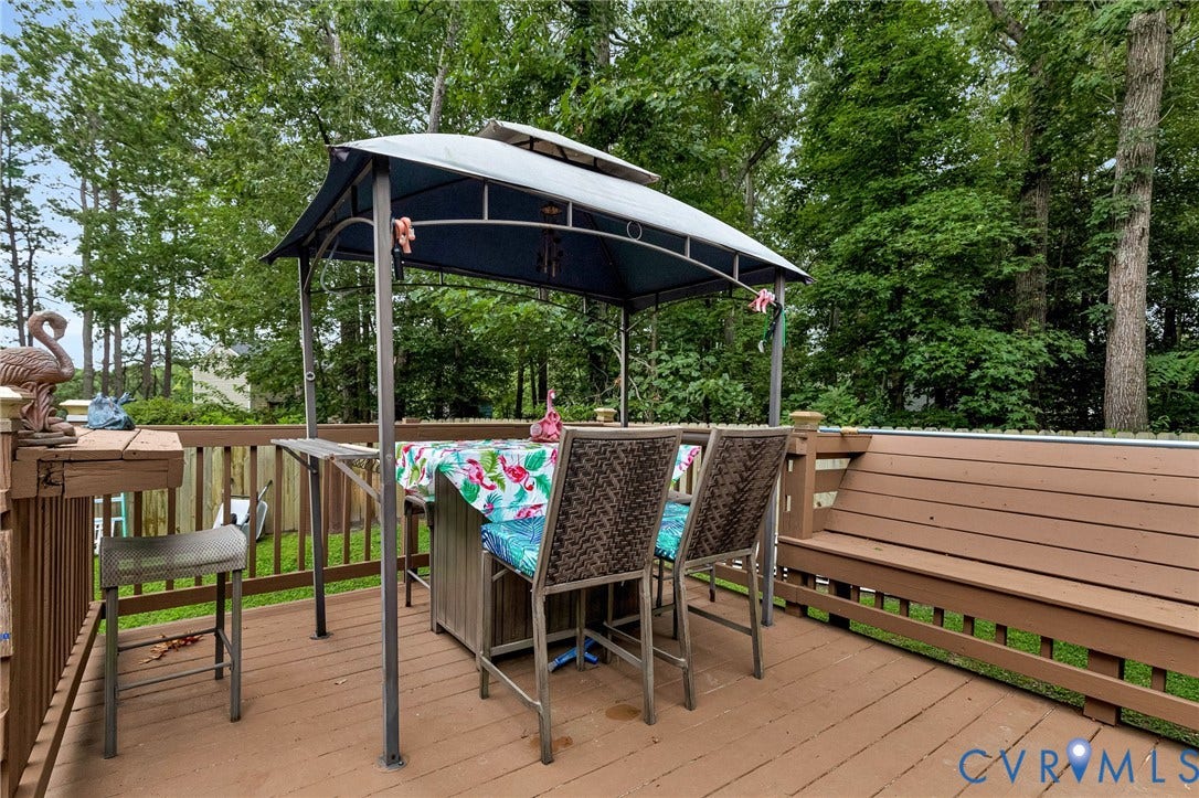 11330 Great Branch Drive, Chester, VA 23831 Spacious wood-finish deck with built-in bench seating and a privacy fence