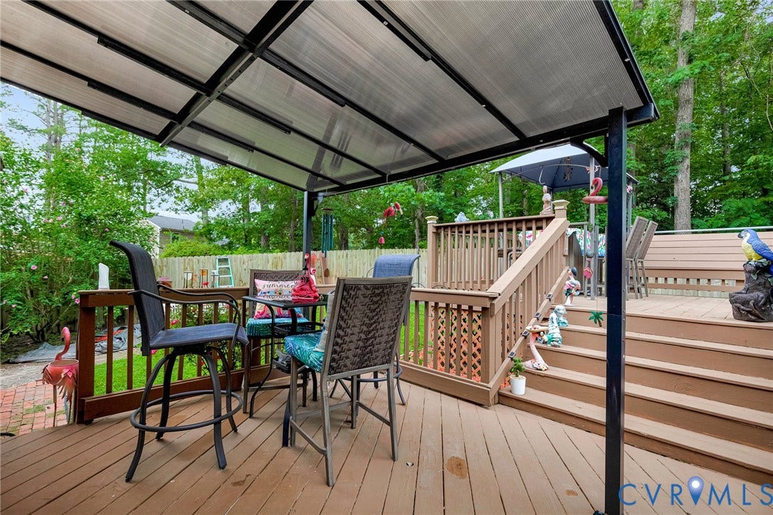 11330 Great Branch Drive, Chester, VA 23831 Multi-level wood-finish deck featuring a covered patio area with a translucent roof, a built-in bench, and perimeter railing