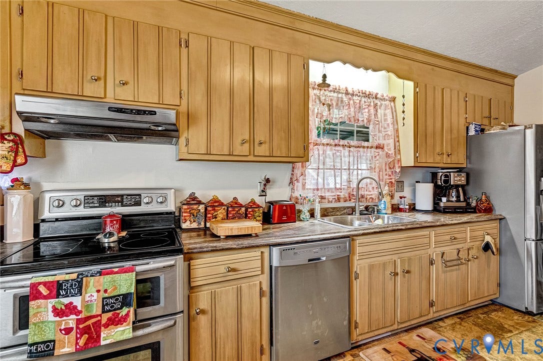11330 Great Branch Drive, Chester, VA 23831 Kitchen featuring natural wood cabinetry, stainless steel appliances, a double basin sink, and laminate countertops