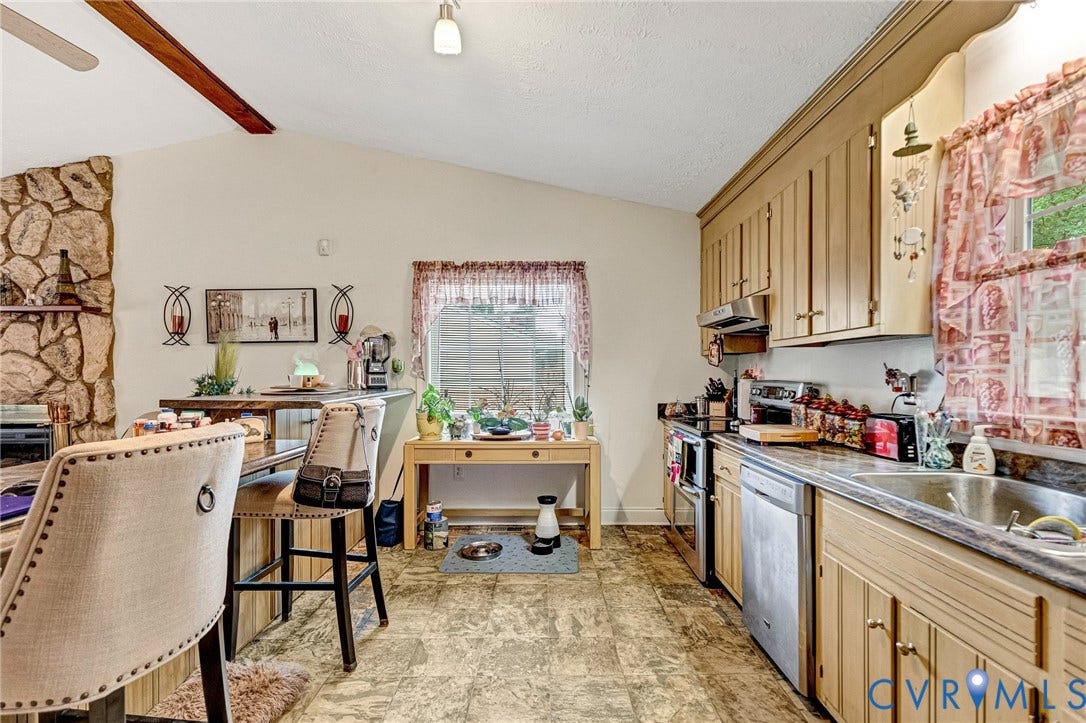 11330 Great Branch Drive, Chester, VA 23831 Kitchen featuring wood-finish flooring, a stainless steel dishwasher, a double basin sink, and light wood cabinetry
