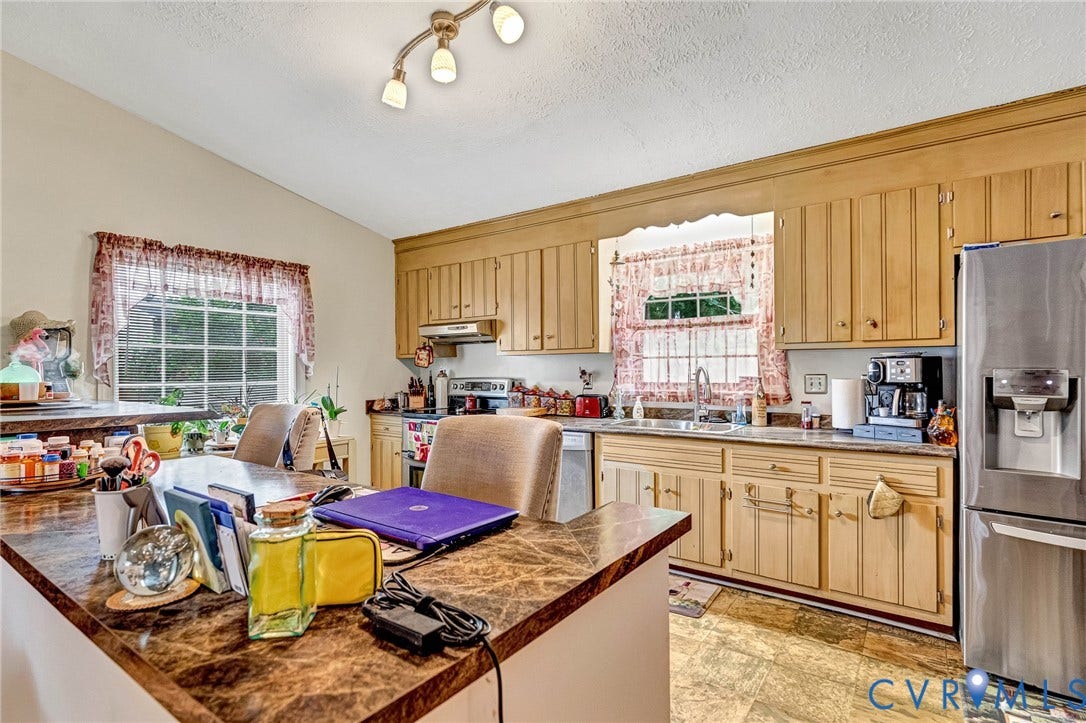 11330 Great Branch Drive, Chester, VA 23831 Kitchen featuring light wood cabinetry, a stainless steel refrigerator, and a track lighting fixture
