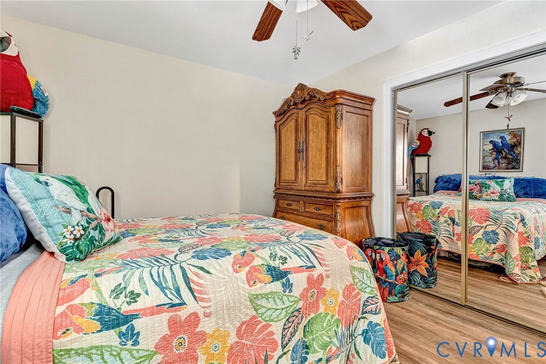 11330 Great Branch Drive, Chester, VA 23831 Interior space featuring wood-finish flooring, a ceiling fan with light fixture, and mirrored closet doors