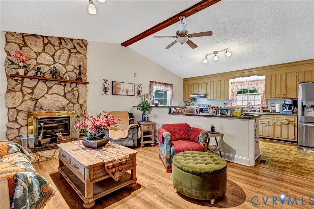 11330 Great Branch Drive, Chester, VA 23831 Living area with vaulted ceilings, exposed wood beams, and wood-finish flooring