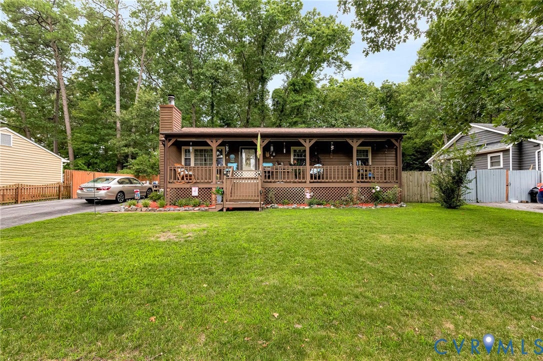 11330 Great Branch Drive, Chester, VA 23831 Single-story residence featuring a covered front porch with decorative railing, a paved driveway, and a spacious front lawn