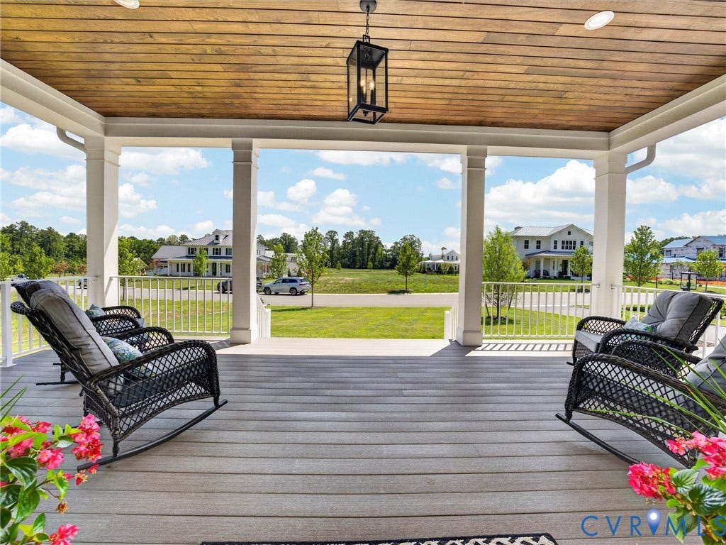Covered porch featuring wood-finish flooring and a planked wood ceiling