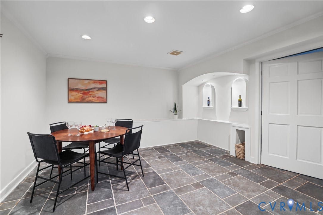 5418 Cary Street Road, Richmond, VA 23226 Multi-tone stone tile flooring, recessed ceiling lighting, and arched wall niches with built-in shelving