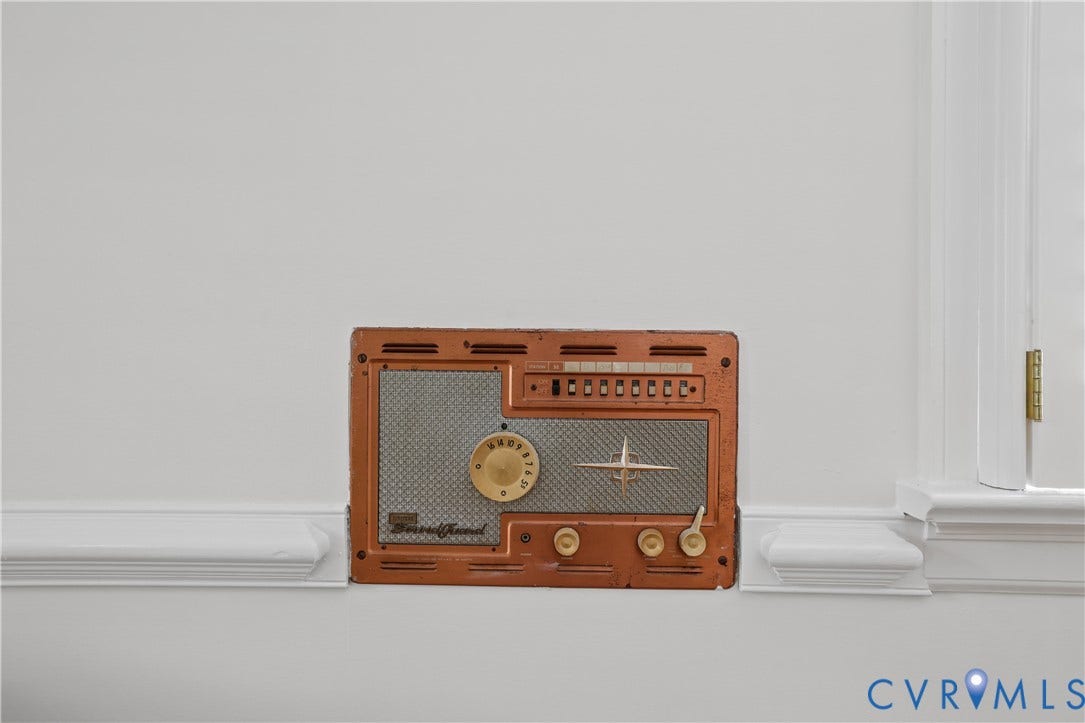 5418 Cary Street Road, Richmond, VA 23226 Built-in copper-finish intercom system with metallic speaker grille, rotary dial, and tactile control switches