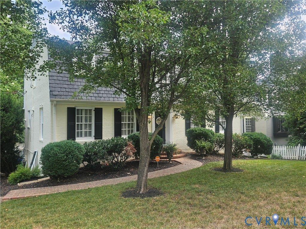 5418 Cary Street Road, Richmond, VA 23226 featuring a curved brick pathway, mature trees, and established shrubs