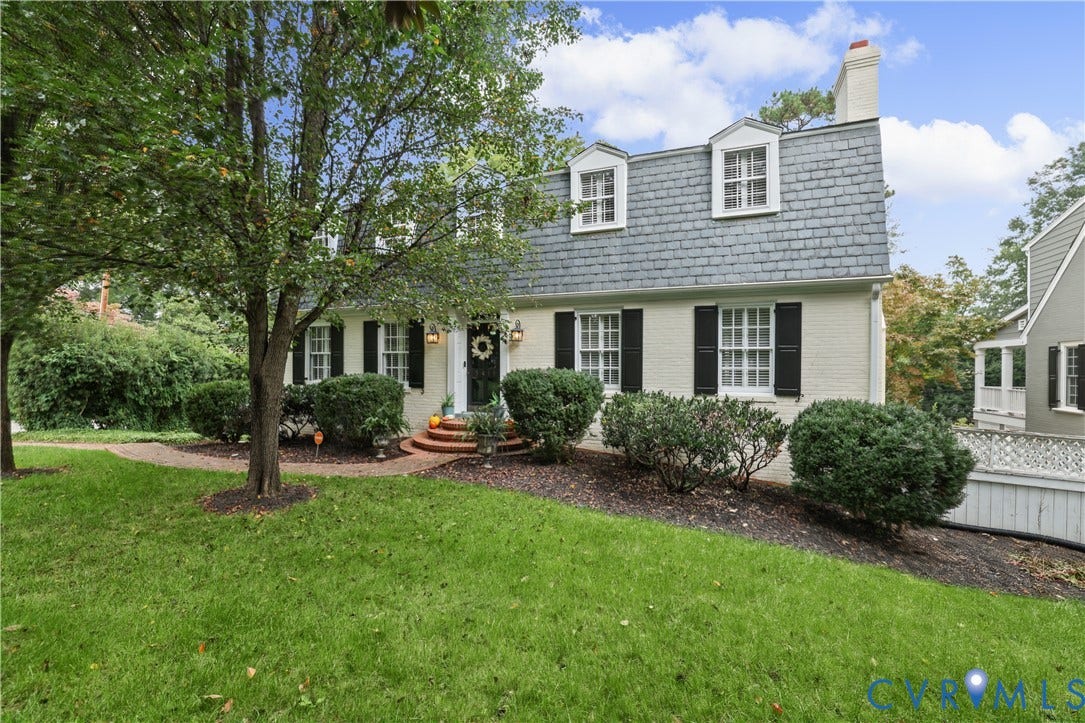 5418 Cary Street Road, Richmond, VA 23226 Dutch Colonial exterior featuring a painted brick facade, slate-shingle mansard roof, dormer windows, and a brick-stepped entryway