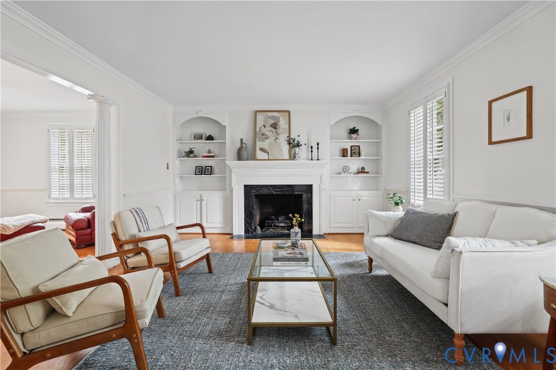5418 Cary Street Road, Richmond, VA 23226 Fireplace with a dark stone surround and