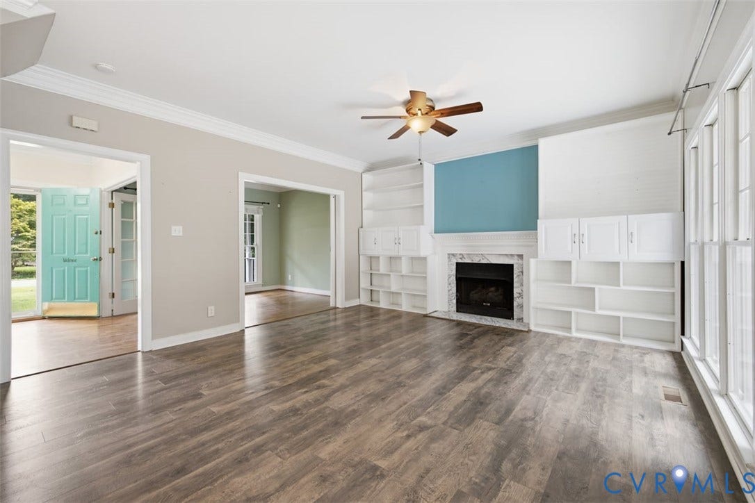 This view shows the open layout of the home.  Can you see yourself relaxing in front of the fire on a cool fall night?