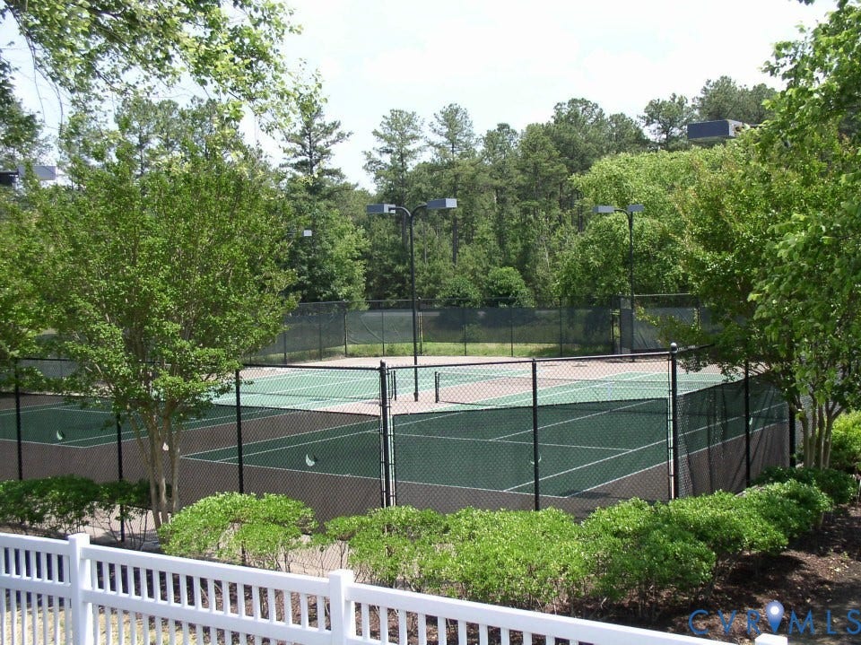 Located near the pool, the community tennis courts are one of the amenities included in your HOA dues. Recently updated, an additional fenced court offers two pickleball courts and a full-size basketball court!