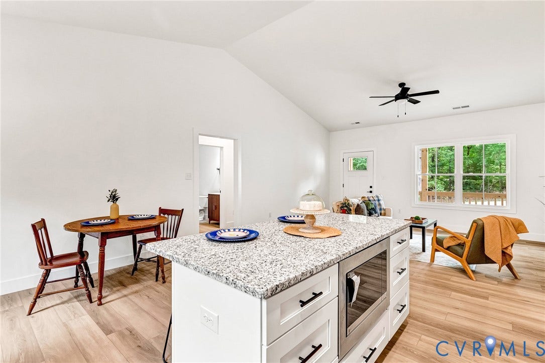 716 Pine Harbour Drive, Pine Harbour, Mineral, VA 23117 Kitchen island featuring a granite-style countertop and integrated microwave drawer