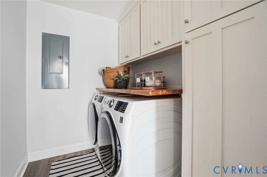 2677 Dogtown Road, Goochland, VA 23063 Laundry area featuring stacked appliances, overhead cabinetry, and a wood-finish countertop
