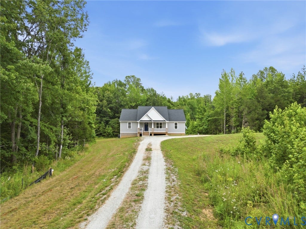 2677 Dogtown Road, Goochland, VA 23063 Ranch-style residence featuring light grey siding, a dark shingle roof, and a covered front porch with white columns
