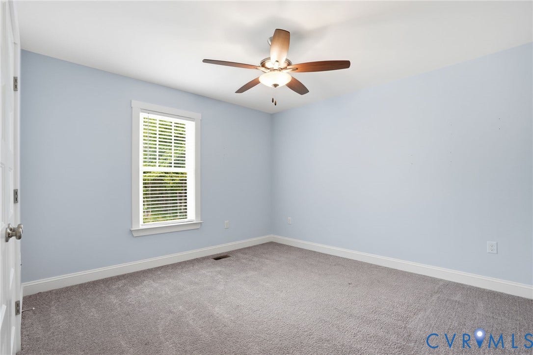2677 Dogtown Road, Goochland, VA 23063 Carpeted room featuring a ceiling fan with integrated lighting, a single window with blinds, and light blue wall finishes