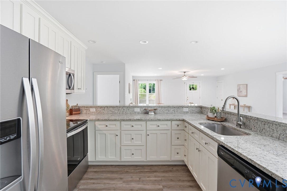 2677 Dogtown Road, Goochland, VA 23063 Kitchen featuring a stainless steel refrigerator, built-in microwave, and electric range