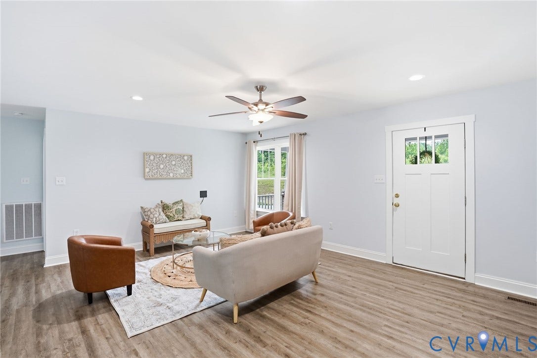 2677 Dogtown Road, Goochland, VA 23063 Spacious living area featuring wood-finish flooring, recessed lighting, and a ceiling fan with integrated light fixture