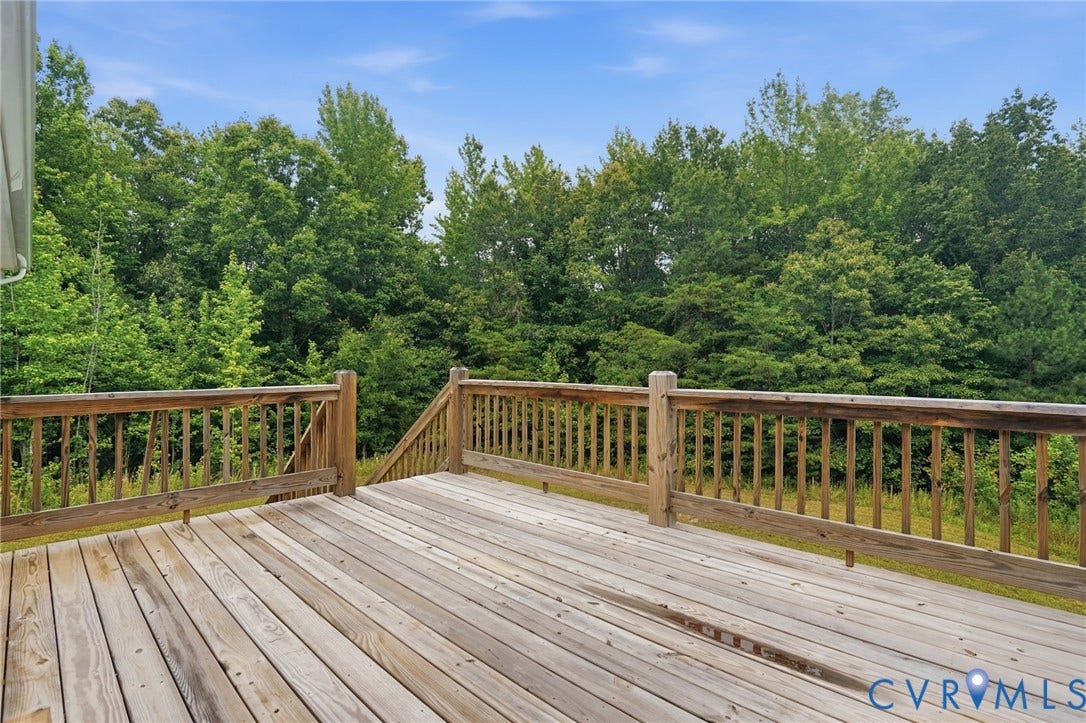 2677 Dogtown Road, Goochland, VA 23063 Expansive wood deck with natural wood railings, offering outdoor living space