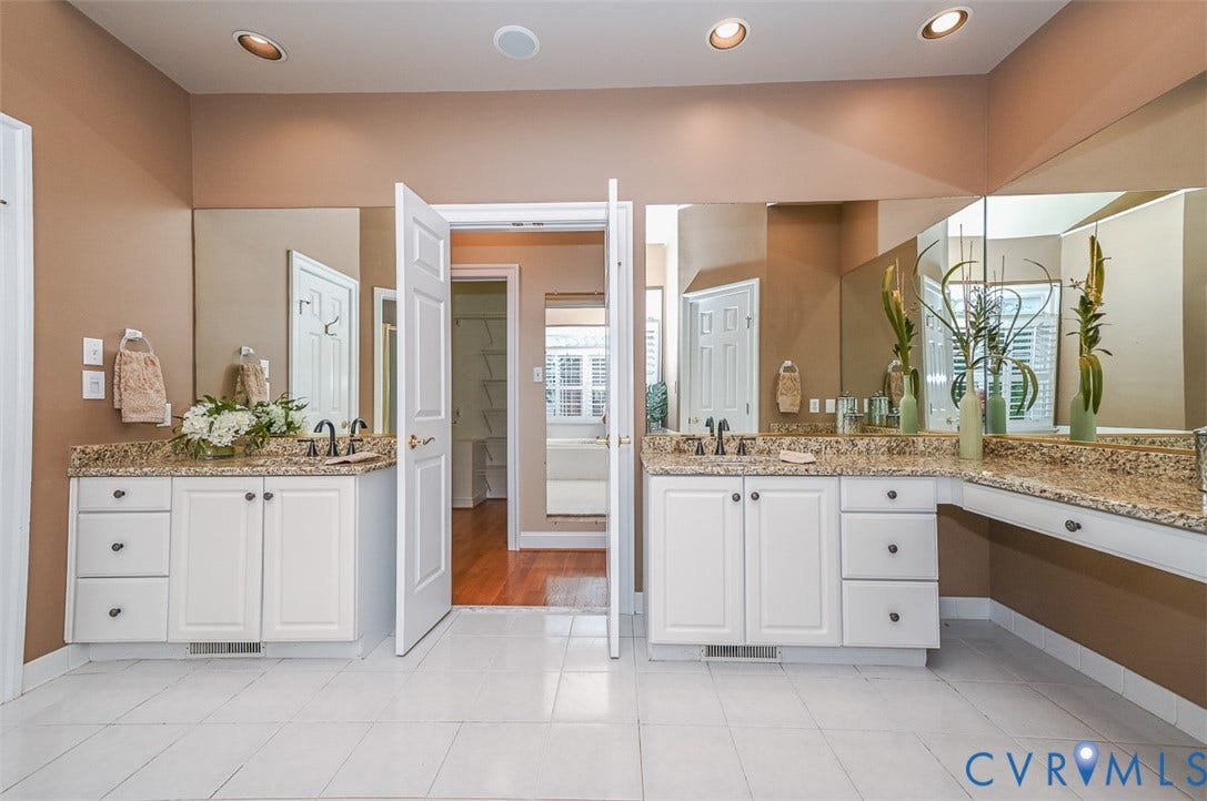 10809 Leabrook Drive, Wyndham, Glen Allen, VA 23059 1st floor Primary Bath with double vanities and make up area, step in shower, linen closet, private water closet and tile floor
