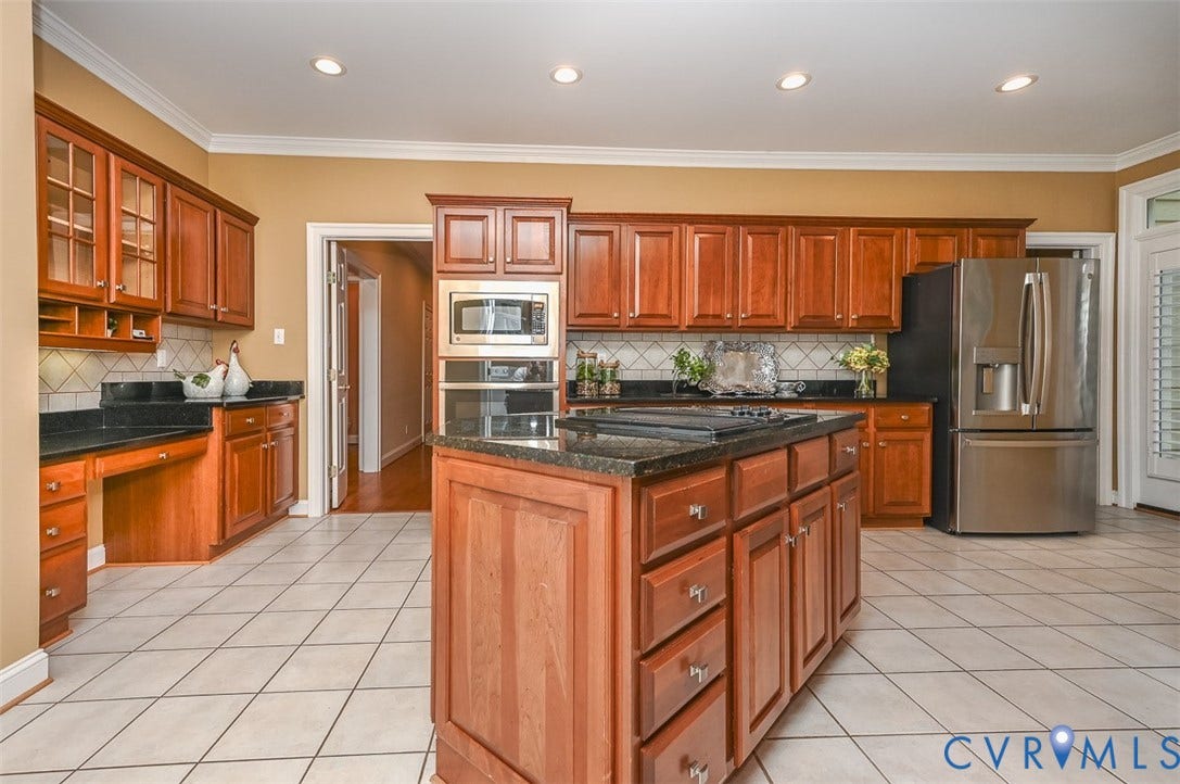 10809 Leabrook Drive, Wyndham, Glen Allen, VA 23059 Kitchen has a Jenn Aire cook top and built in wall oven, desk and lots of Cherry cabinets.