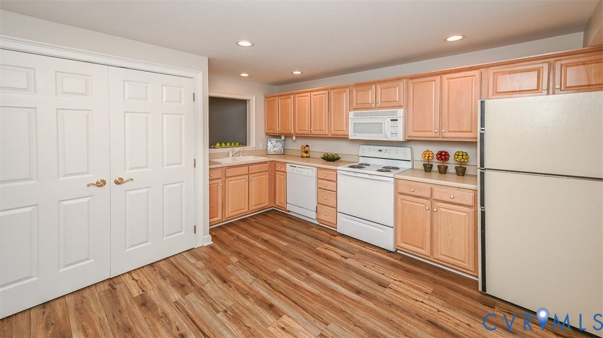 10809 Leabrook Drive, Wyndham, Glen Allen, VA 23059 Another view of the Basement Kitchen with pass thru window to the Rec room. 2nd Laundry utility room with washer and dryer included behind the double doors. Large Pantry on other side