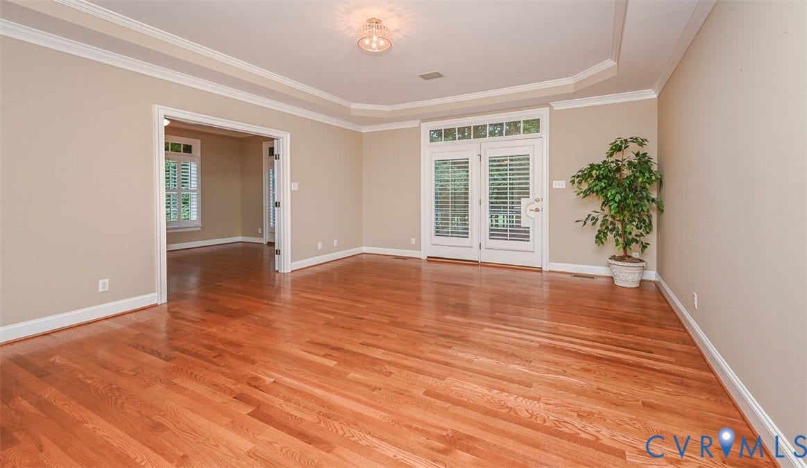10809 Leabrook Drive, Wyndham, Glen Allen, VA 23059 Hardwood floors, tray ceiling, crown molding, door to exterior deck/backyard and doors to a flex room that was used as an office but could be a private sitting area or nursery