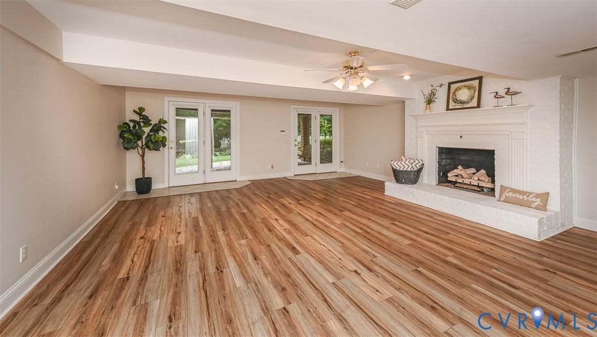 10809 Leabrook Drive, Wyndham, Glen Allen, VA 23059 Basement Rec Room with gas fireplace and 2 walk out doors to the exterior spacious stone patio
