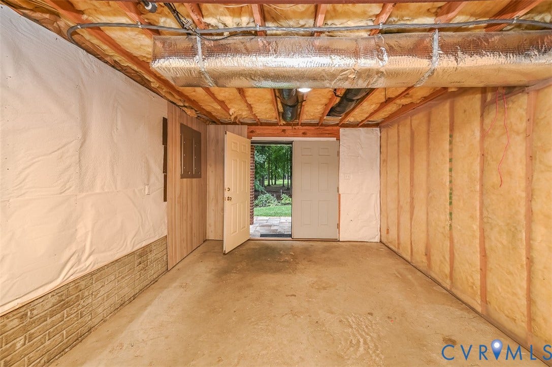10809 Leabrook Drive, Wyndham, Glen Allen, VA 23059 Presently used as a work room. This is only 1 side. Very spacious! Double doors to the exterior. Gorgeous view of the backyard and golf course