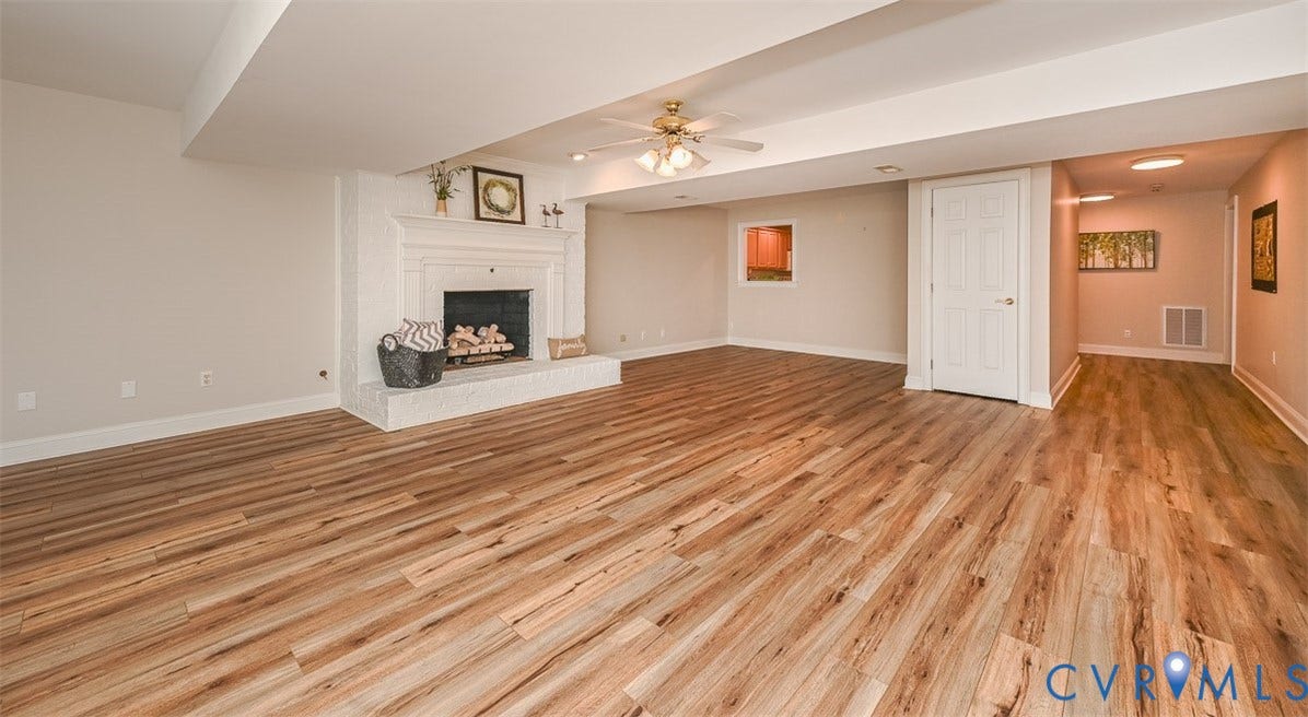 10809 Leabrook Drive, Wyndham, Glen Allen, VA 23059 Walk out Basement Rec Room with wood floor showing other side with nook area with pass through to kitchen or also great for a game table..